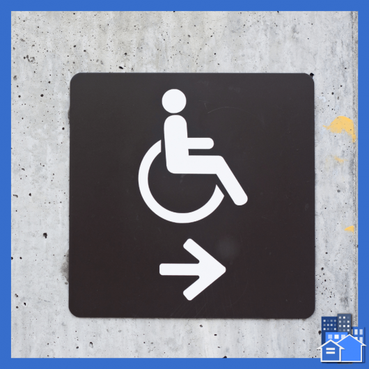 Handicap sign with an arrow pointing right