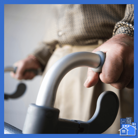 Older person with a walker on a white background, requesting a reasonable accommodation.