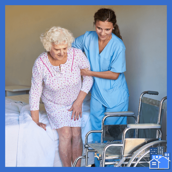 A live in nurse helping an elderly woman into her wheelchair