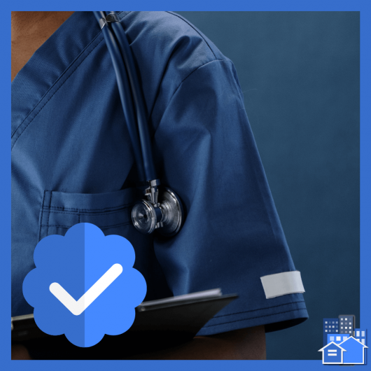 Person wearing scrubs and stethoscope on blue background verifying live in aide.